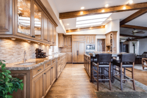 kitchen wood flooring and cabinets with dining table